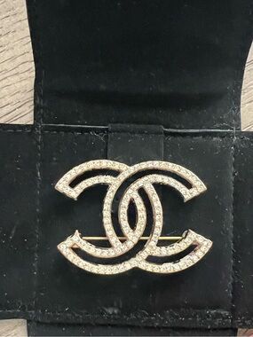 CHANEL Gold-Tone Crystal Double C Brooch on Black Suede Backing